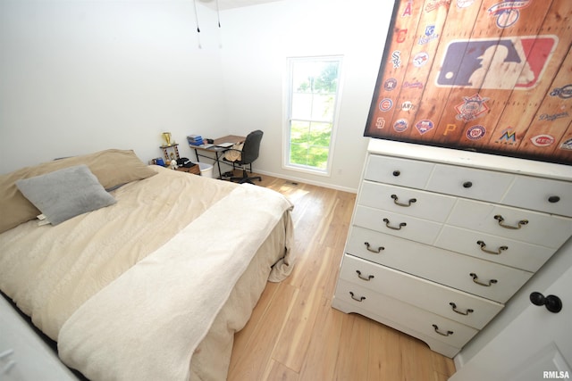 bedroom featuring light wood-type flooring