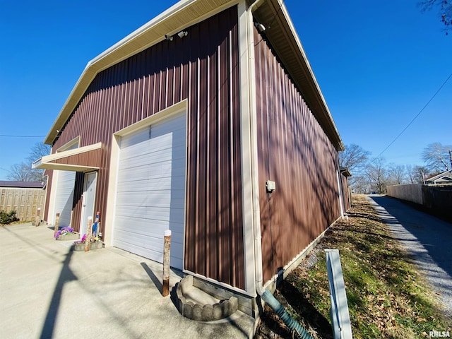 exterior space with a garage and an outdoor structure