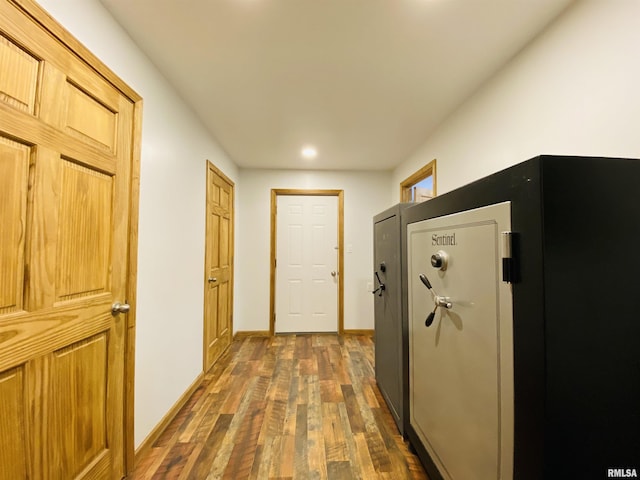 hallway with dark hardwood / wood-style floors