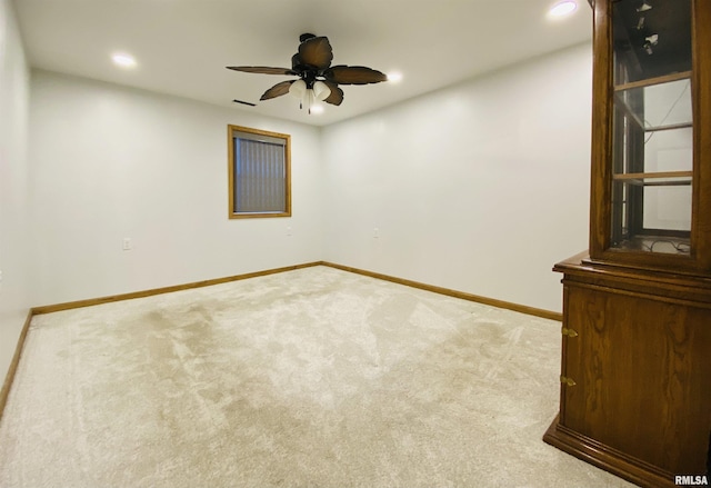 carpeted empty room with ceiling fan