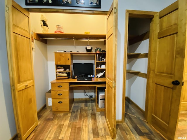 home office with hardwood / wood-style floors