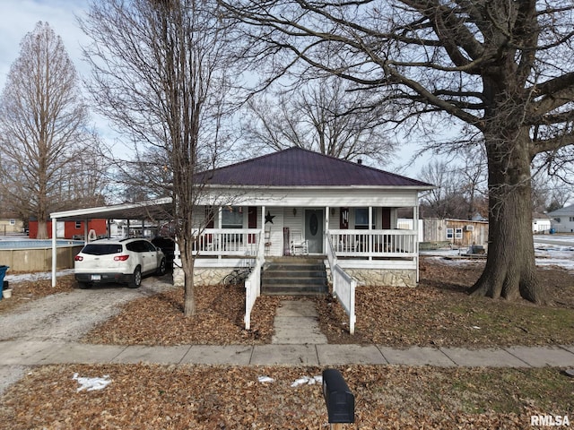 bungalow with a carport and a porch