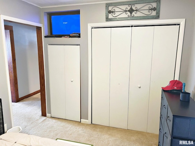 carpeted bedroom featuring ornamental molding