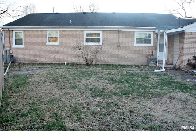 view of side of property featuring a yard