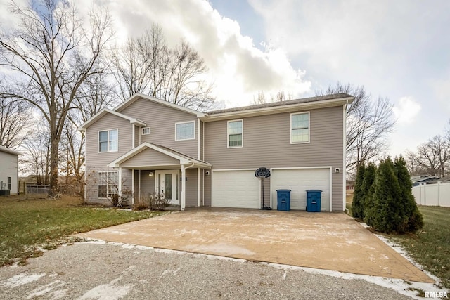 front of property featuring a garage and a front lawn