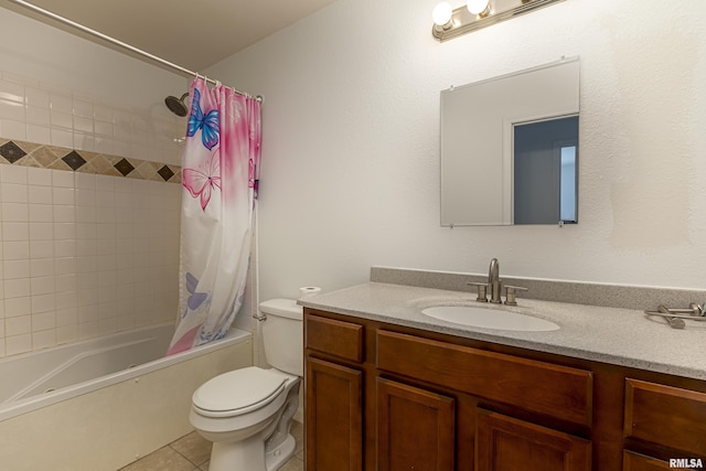 full bathroom featuring toilet, tile patterned flooring, vanity, and shower / tub combo with curtain