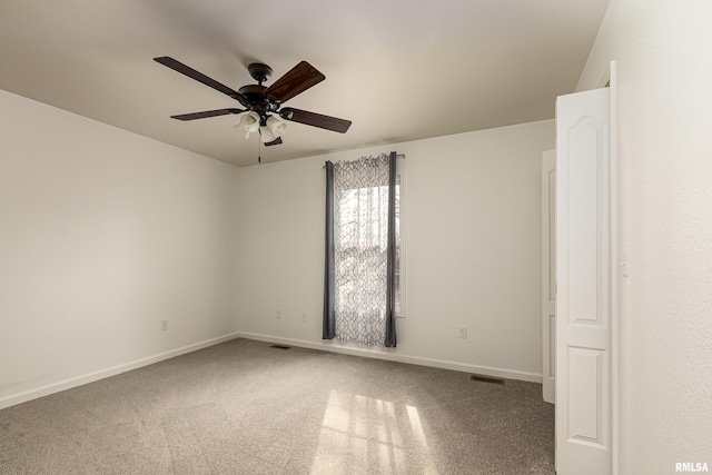 carpeted empty room featuring ceiling fan