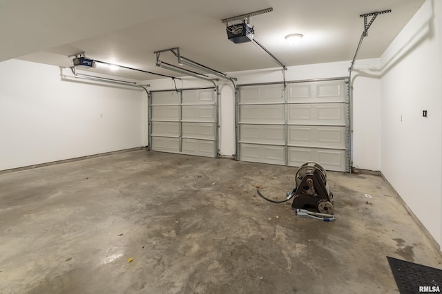 garage featuring a garage door opener