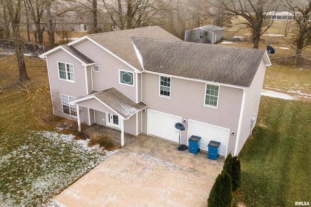 back of property with a garage