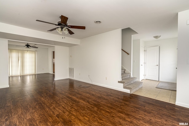 empty room featuring ceiling fan and light hardwood / wood-style flooring