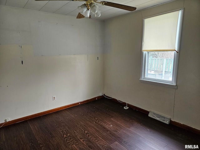 unfurnished room featuring dark hardwood / wood-style floors and ceiling fan