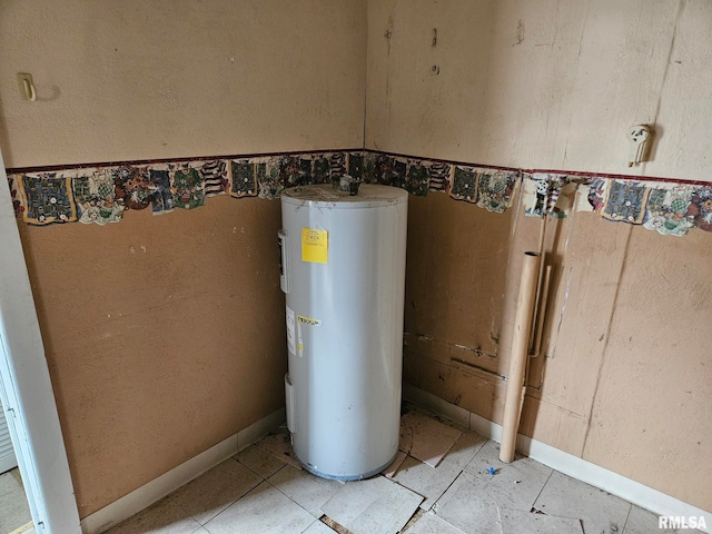 utility room featuring water heater