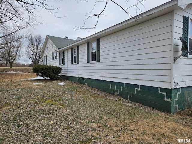 view of property exterior featuring a yard