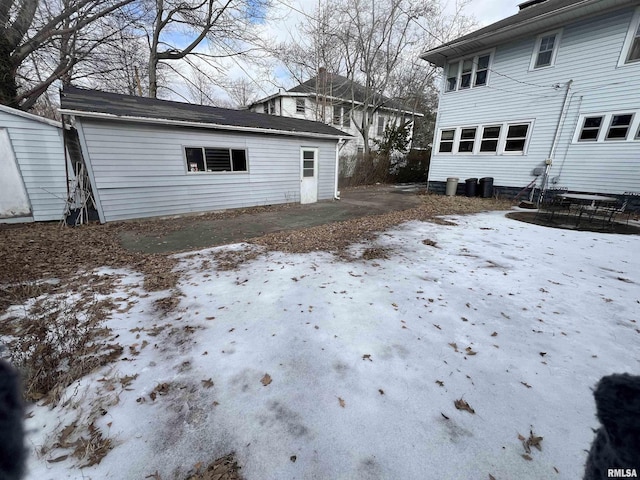 yard covered in snow featuring central air condition unit