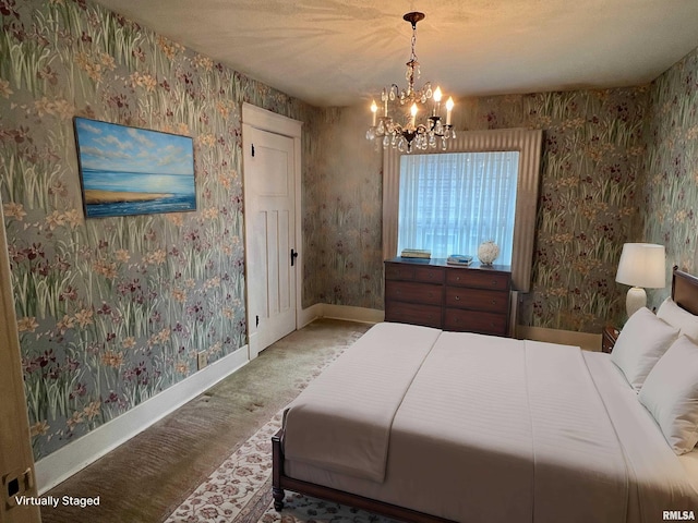 carpeted bedroom with a notable chandelier