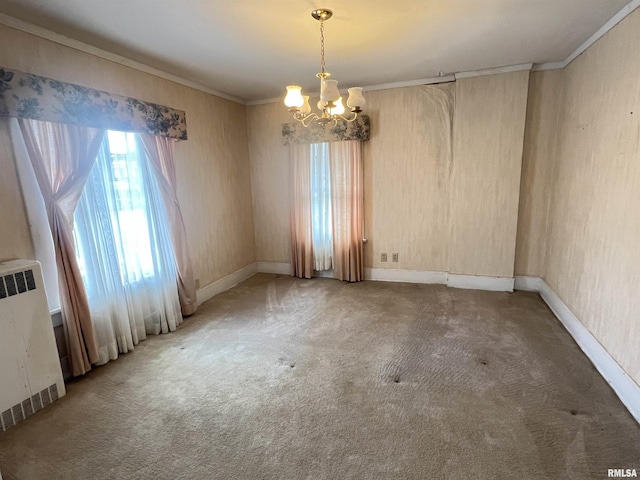 unfurnished room featuring a chandelier, ornamental molding, radiator, and carpet