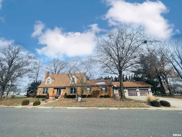 new england style home with a garage