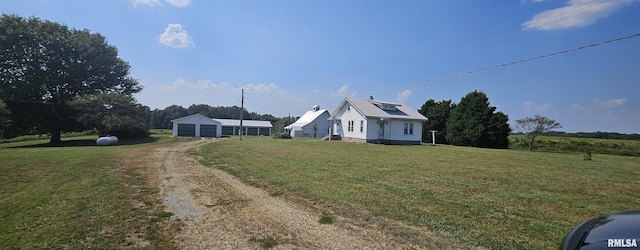 view of front facade featuring a garage and a front lawn