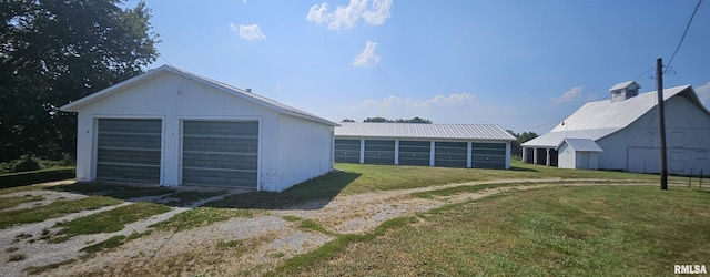 garage with a lawn