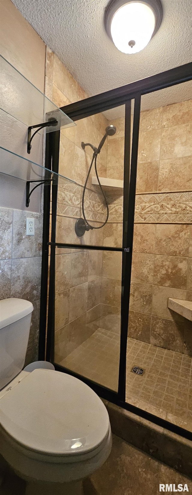 103 David Dr, Mcclure, IL 62957 - bathroom featuring a stall shower and a textured ceiling