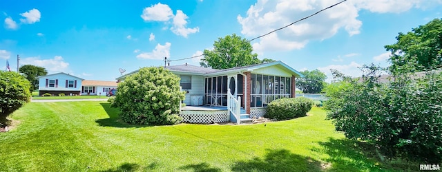 103 David Dr, Mcclure, IL 62957 - back of house featuring a sunroom, a yard, brick siding, and a deck