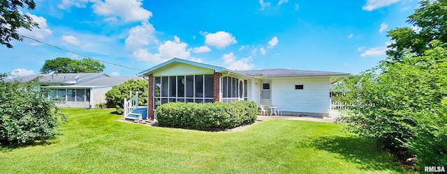 103 David Dr, Mcclure, IL 62957 - back of house featuring a sunroom and a lawn