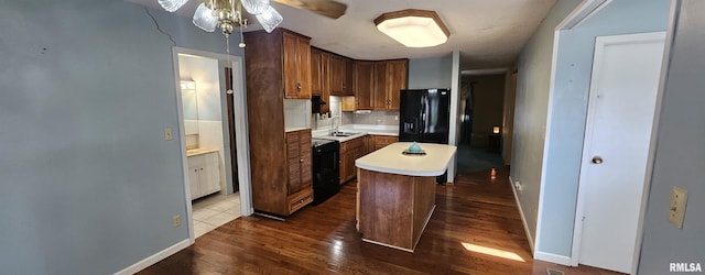 103 David Dr, Mcclure, IL 62957 - kitchen featuring black appliances, light countertops, backsplash, dark wood finished floors, and a ceiling fan