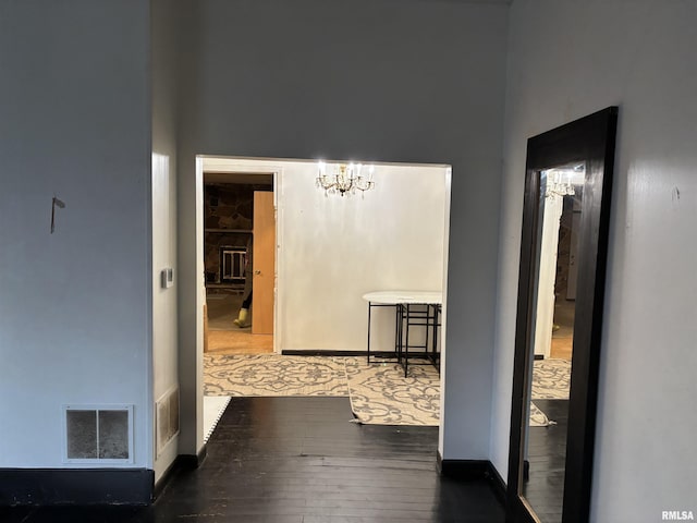 hallway featuring a notable chandelier