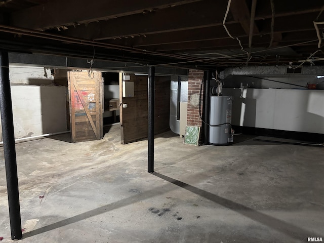 basement featuring heating unit and gas water heater