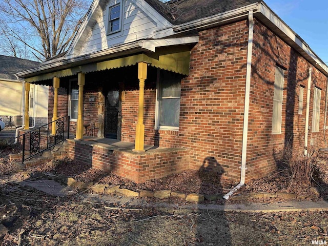 view of property exterior with covered porch