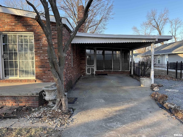 exterior space featuring a carport