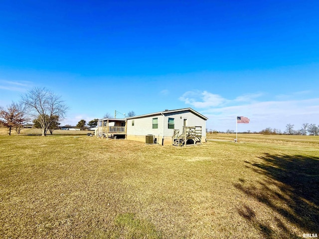 view of yard with a rural view