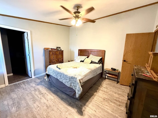 bedroom with ornamental molding, ceiling fan, and light wood-type flooring