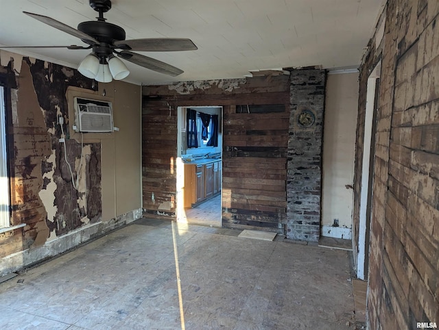 unfurnished living room featuring ceiling fan and a wall unit AC