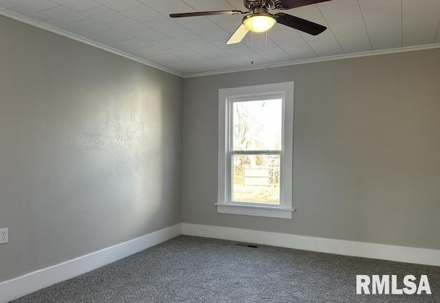 spare room with ornamental molding, ceiling fan, and carpet