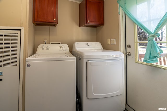 laundry room featuring cabinets and independent washer and dryer