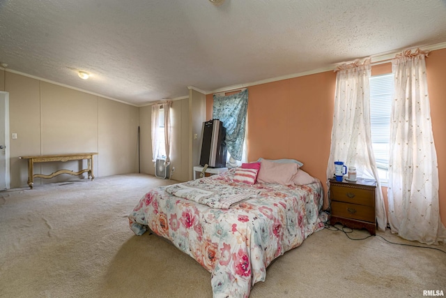 bedroom featuring crown molding, light colored carpet, and a textured ceiling