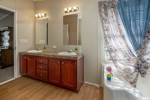 bathroom featuring vanity and hardwood / wood-style flooring