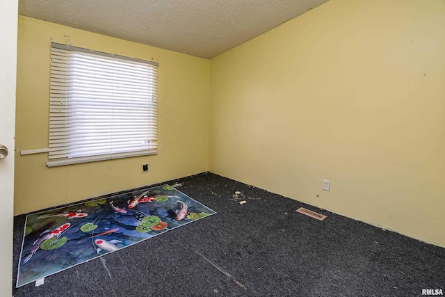 rec room with carpet flooring and a textured ceiling