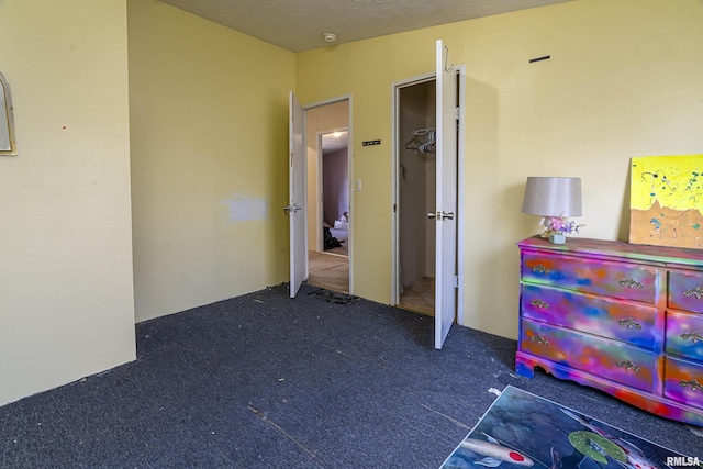 bedroom featuring dark carpet