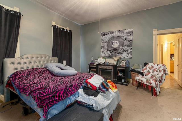 carpeted bedroom with a textured ceiling