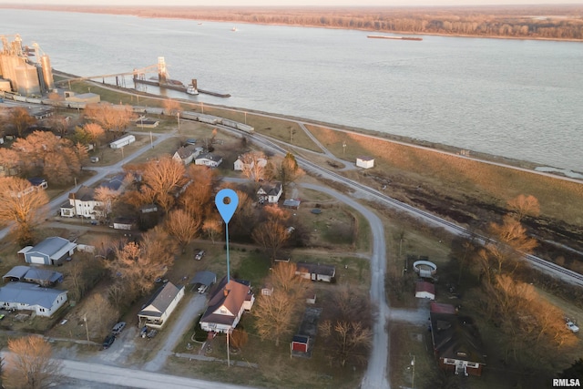 aerial view at dusk with a water view