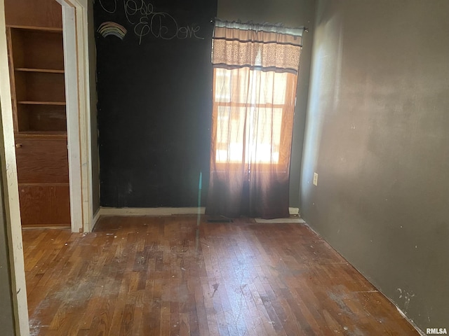 empty room featuring hardwood / wood-style flooring