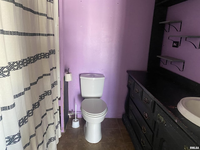 bathroom with tile patterned floors and toilet