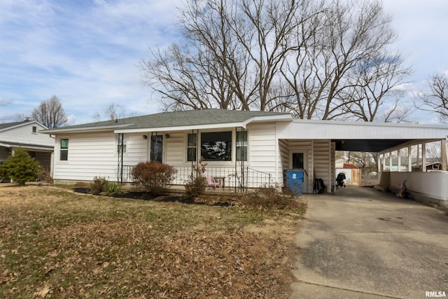 single story home with a front yard and a carport