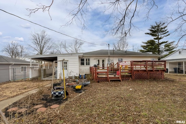 back of property featuring french doors and a deck