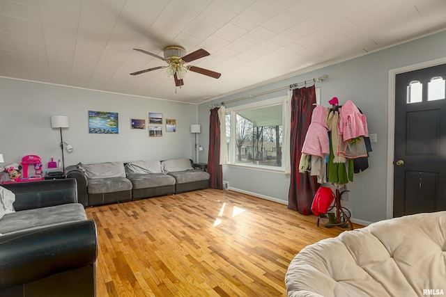 living room featuring ceiling fan and light wood-type flooring