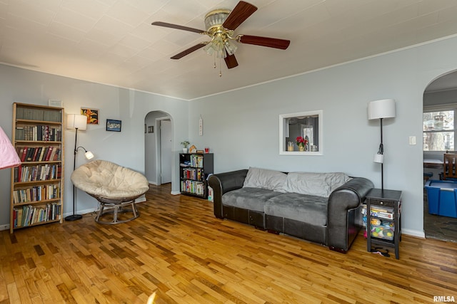 living room featuring light hardwood / wood-style floors and ceiling fan