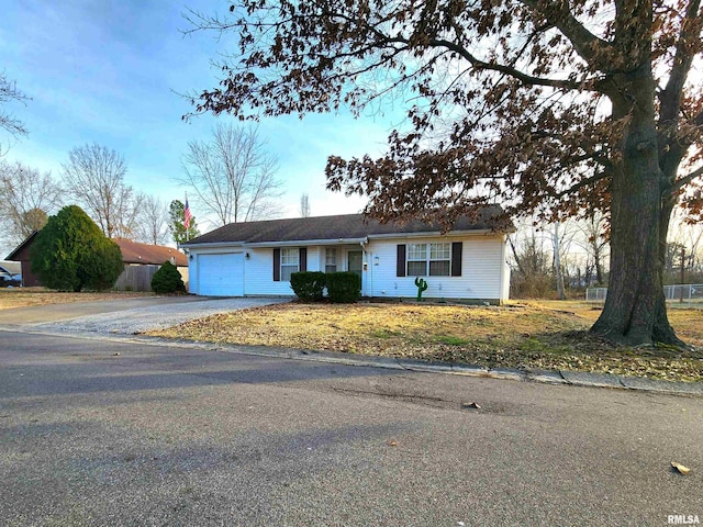 ranch-style home featuring a garage