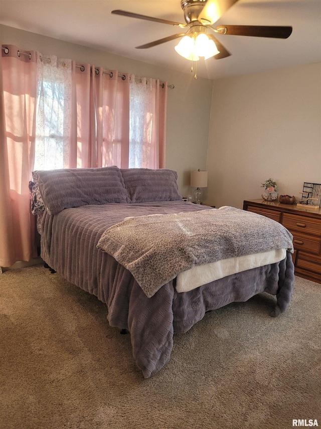 bedroom featuring ceiling fan and light colored carpet